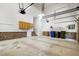 Spacious garage with storage cabinets, brick accents, and ample room for vehicles at 201 Red Bud Ln, Chapel Hill, NC 27514