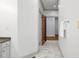 Elegant hallway features marble floors, wooden door, and access to multiple rooms creating a seamless flow at 201 Red Bud Ln, Chapel Hill, NC 27514