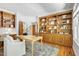 Spacious home office featuring custom shelving and ample natural light and access to a study area at 201 Red Bud Ln, Chapel Hill, NC 27514