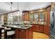 Kitchen with island, granite countertops, stainless appliances, and wood cabinets at 201 Red Bud Ln, Chapel Hill, NC 27514