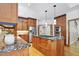 Spacious kitchen with wood cabinets, granite countertops, and stainless appliances at 201 Red Bud Ln, Chapel Hill, NC 27514