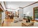 An open-concept living area that connects to the dining area and kitchen, great for entertaining at 201 Red Bud Ln, Chapel Hill, NC 27514