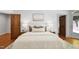 Comfortable main bedroom showcasing a plush bed, stylish bedside tables and hardwood floors at 201 Red Bud Ln, Chapel Hill, NC 27514