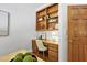 Cozy office space featuring built-in wooden shelving and a classic wooden desk with a comfortable chair at 201 Red Bud Ln, Chapel Hill, NC 27514