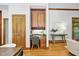 Cozy office nook with custom cabinets and desk is located next to the dining area at 201 Red Bud Ln, Chapel Hill, NC 27514