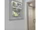 Bright bathroom showcasing a glass-enclosed shower, neutral tile, and a sunlit window bringing the outdoors in at 201 Red Bud Ln, Chapel Hill, NC 27514
