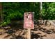 Hiking trail sign in a wooded area for outdoor enthusiasts in a community at 203 E Winmore Ave, Chapel Hill, NC 27516