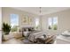 Serene main bedroom with plush bedding, natural light, and stylish decor at 203 E Winmore Ave, Chapel Hill, NC 27516