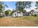 Back exterior view of the home and spacious backyard on a sunny day at 208 W Holt St, Burlington, NC 27217