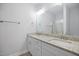 Bathroom vanity with double sinks, granite countertop and updated fixtures at 208 W Holt St, Burlington, NC 27217