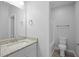 Granite countertop on single sink vanity, a toilet, and a bath/shower combination at 208 W Holt St, Burlington, NC 27217