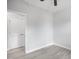 Bright bedroom features a neutral color palette, ceiling fan, and wood-look flooring at 208 W Holt St, Burlington, NC 27217