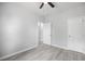 Bedroom with light gray walls, wood-look flooring, and closet access at 208 W Holt St, Burlington, NC 27217