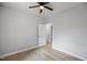 Cozy bedroom featuring a ceiling fan and wood-look flooring at 208 W Holt St, Burlington, NC 27217