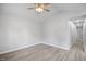 Bright bedroom features neutral paint, luxury vinyl flooring, and a view into the hallway at 208 W Holt St, Burlington, NC 27217