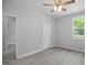 Bright bedroom featuring a ceiling fan and natural light at 208 W Holt St, Burlington, NC 27217