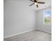 Cozy bedroom with natural light from the window and a modern ceiling fan at 208 W Holt St, Burlington, NC 27217