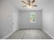Light-filled bedroom featuring ceiling fan and an exterior view at 208 W Holt St, Burlington, NC 27217