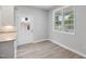 Bright breakfast nook features luxury vinyl flooring, neutral paint, and a large window at 208 W Holt St, Burlington, NC 27217