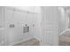 White laundry room with connections and a wire shelf at 208 W Holt St, Burlington, NC 27217