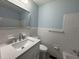 Bright bathroom with white tiled shower and sink vanity at 213 N Brevard St, Selma, NC 27576