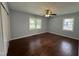 Inviting bedroom with hardwood floors and plenty of sunlight at 213 N Brevard St, Selma, NC 27576