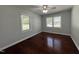 Cozy bedroom with hardwood floors and sunlit windows at 213 N Brevard St, Selma, NC 27576