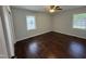 Comfortable bedroom with natural light from two windows at 213 N Brevard St, Selma, NC 27576