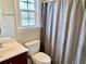 Bathroom featuring a single sink vanity and shower with curtain at 2193 Boyd Creek Dr, Graham, NC 27253