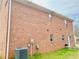 Exterior side view of the home with brick facade at 2193 Boyd Creek Dr, Graham, NC 27253