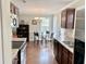 Modern kitchen with stainless steel appliances, granite countertops, and bright dining area at 2193 Boyd Creek Dr, Graham, NC 27253