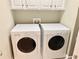 Laundry room featuring white washer and dryer appliances at 2193 Boyd Creek Dr, Graham, NC 27253