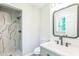 Bathroom with walk in shower, a modern mirror, and a gray vanity at 2300 Radius Cir, Sanford, NC 27330