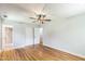 Bedroom features hardwood floors, neutral paint, closet and ensuite bathroom access at 2300 Radius Cir, Sanford, NC 27330