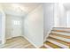 Entryway featuring hard floors, white trim, and a staircase at 2300 Radius Cir, Sanford, NC 27330