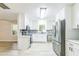 Bright kitchen with stainless appliances, white cabinets and tile backsplash at 2300 Radius Cir, Sanford, NC 27330