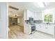 Open kitchen with stainless appliances, gray backsplash and white cabinets at 2300 Radius Cir, Sanford, NC 27330