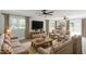 Cozy living room with wood-look floors, bright windows, and comfortable seating at 2300 Radius Cir, Sanford, NC 27330