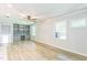 Open living room with wood-look floors, built-in shelving, and bright windows at 2300 Radius Cir, Sanford, NC 27330