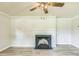 Living room featuring neutral walls, fireplace, decorative light fixture, and wood flooring at 2300 Radius Cir, Sanford, NC 27330