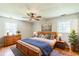 Main bedroom boasts wood floors, a ceiling fan, and ample natural light at 2300 Radius Cir, Sanford, NC 27330
