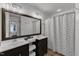 Ensuite bathroom features a double sink and shower-tub combo at 24 W Canterbury Ct, Wendell, NC 27591