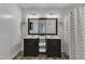 Ensuite bathroom features a double sink and shower-tub combo at 24 W Canterbury Ct, Wendell, NC 27591
