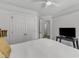 Bedroom with closet features a ceiling fan and neutral decor at 24 W Canterbury Ct, Wendell, NC 27591