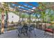 Relaxing covered patio with dining set overlooking the backyard, perfect for outdoor enjoyment at 24 W Canterbury Ct, Wendell, NC 27591