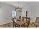 The formal dining room includes a decorative table, seating, and an ornamental chandelier at 24 W Canterbury Ct, Wendell, NC 27591