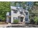 Well-maintained home with white siding, a gray roof, black shutters, and a landscaped front yard at 24 W Canterbury Ct, Wendell, NC 27591