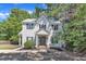Charming two-story home with classic architectural details, manicured landscaping, and a welcoming front porch at 24 W Canterbury Ct, Wendell, NC 27591