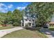 Charming two-story home with a well-manicured lawn and a spacious driveway at 24 W Canterbury Ct, Wendell, NC 27591