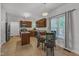 Eat-in kitchen features wooden cabinets, an island, and stainless steel appliances at 24 W Canterbury Ct, Wendell, NC 27591